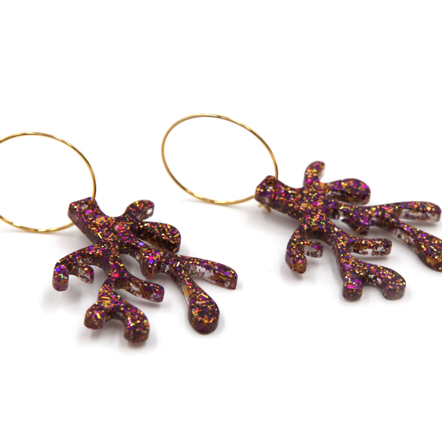 other side view of purple glitter resin coral gold plated hoop earrings on a white background