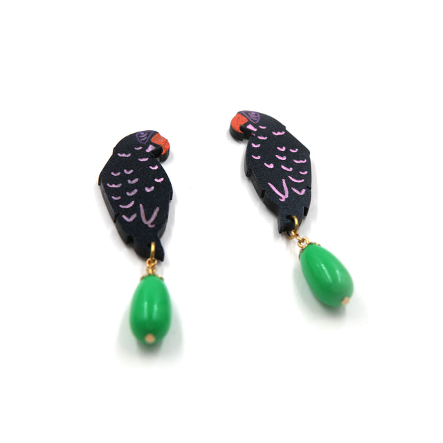 other side view of laser cut parrot statement earrings, hand painted with green vintage beads on a white background