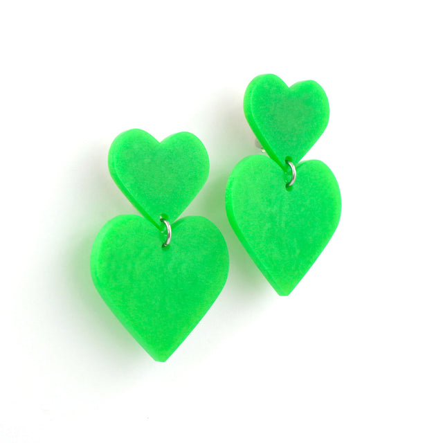 lime green double hearts earrings hanging from a white background.