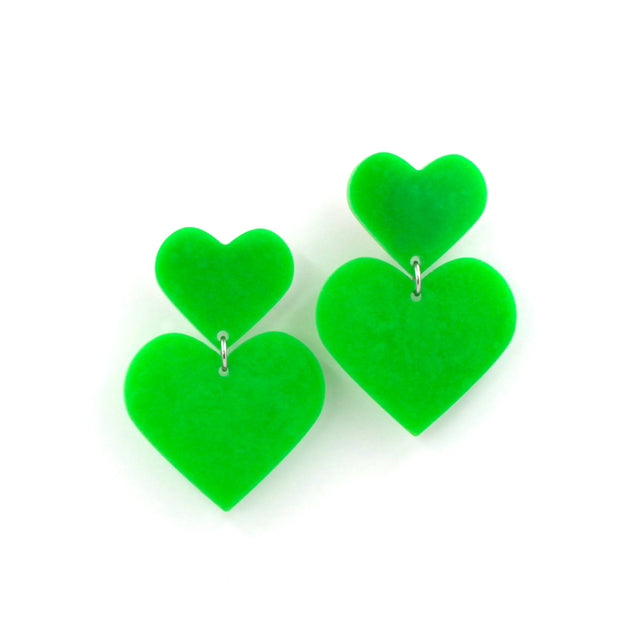 lime green double hearts earrings hanging from a white background.