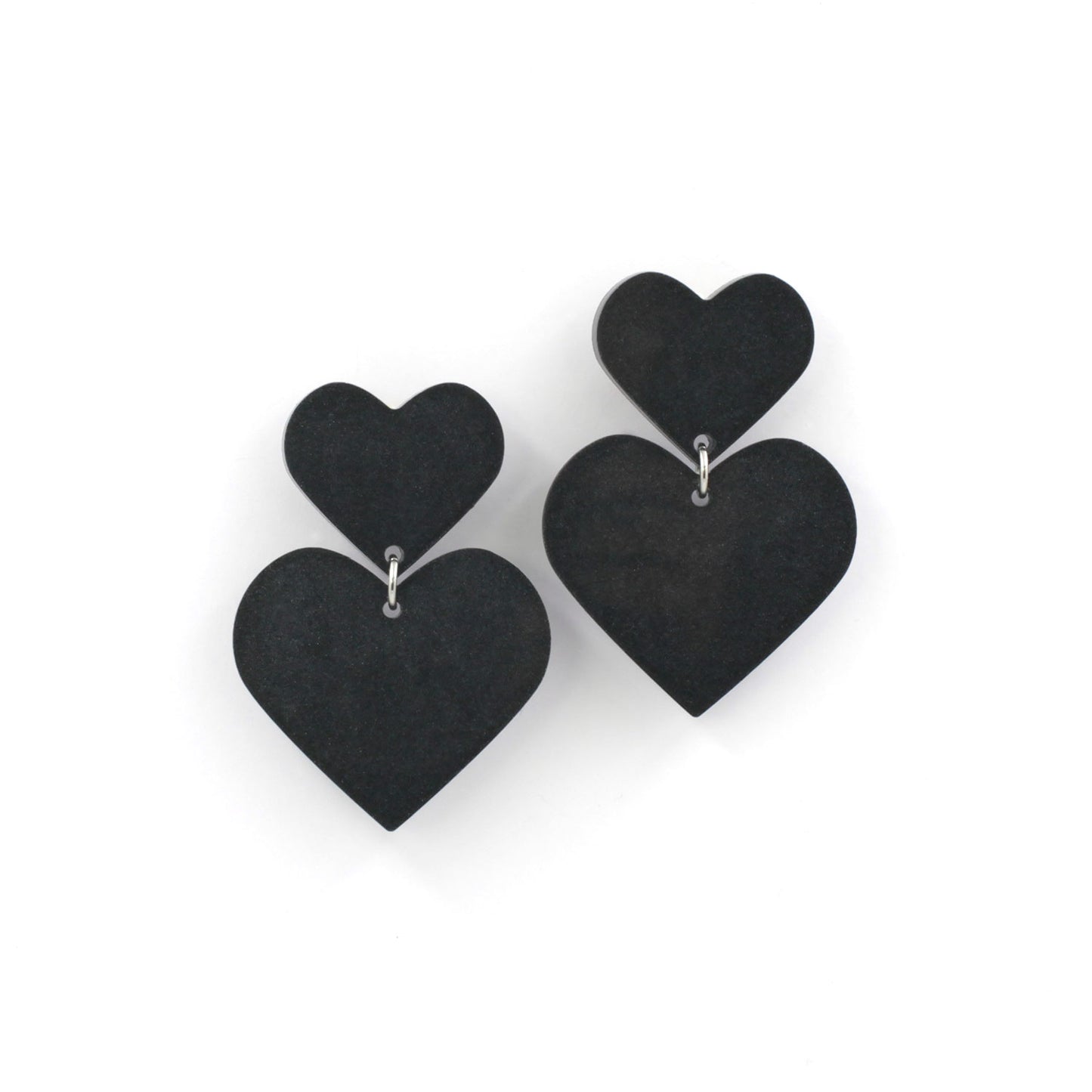 black hearts earrings on a white background.