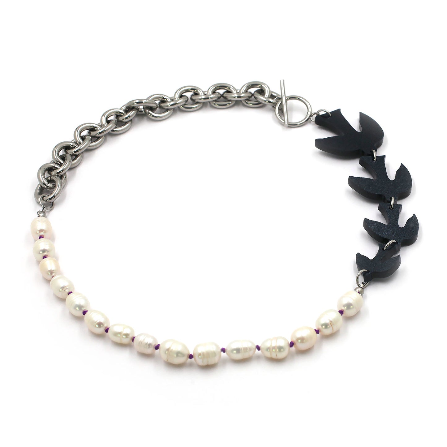 this is a laser cut birds necklace with pearls and chunky chain and a t clasp closure on a white background.