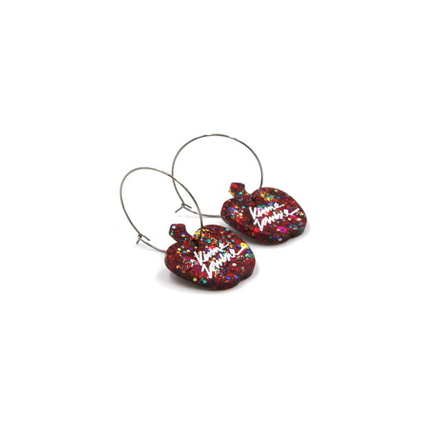 side view of red glitter resin apple stainless steel hoops earrings on a white background