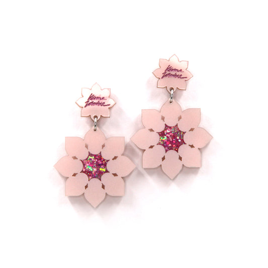 other view of Pink pearly laser-cut acrylic lotus flowers earrings on a white background