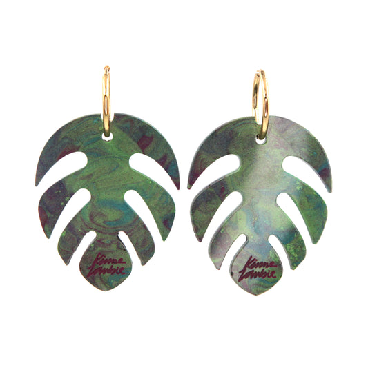 green and pink marbled resin monstera leaves statement gold plated hoop earrings on a white background