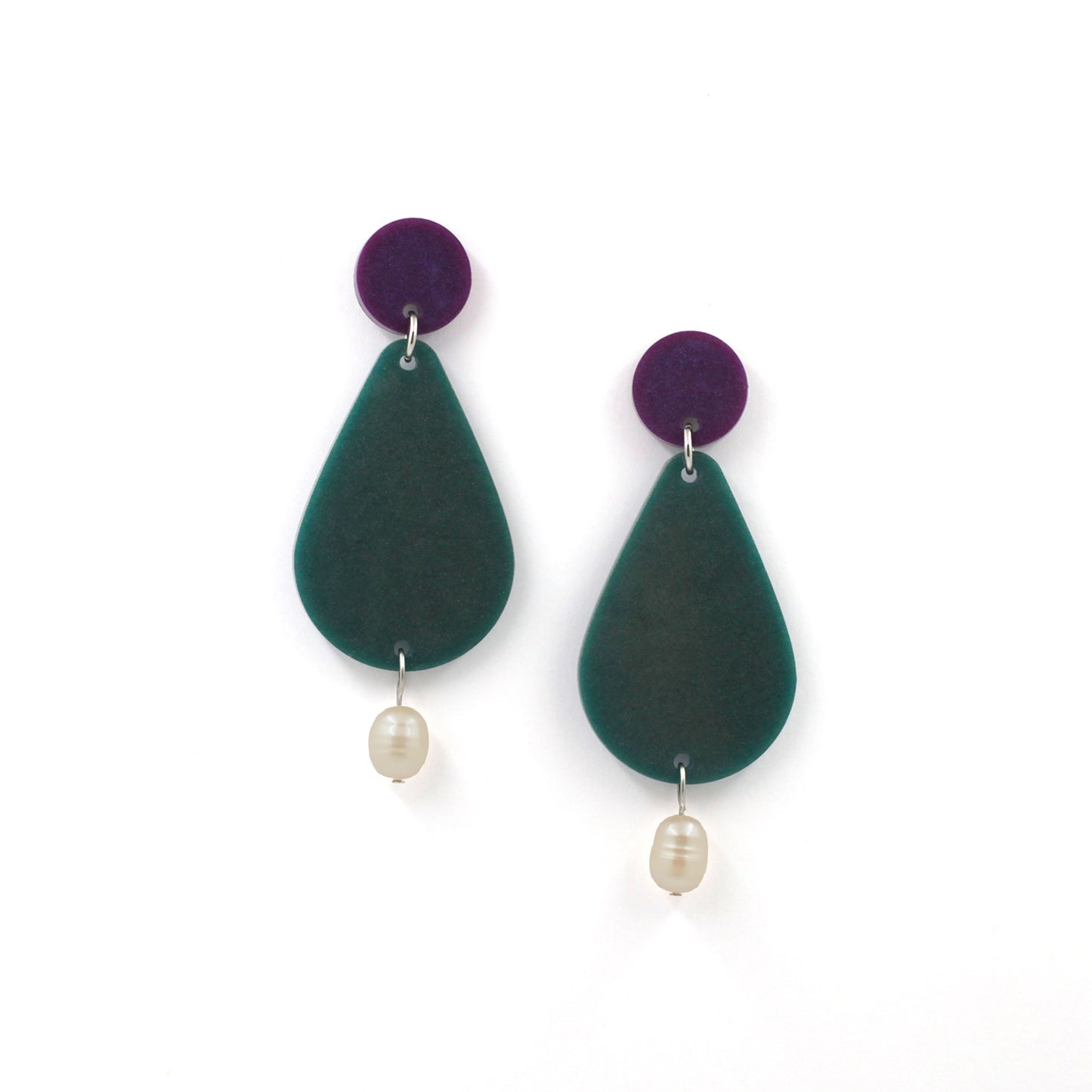 picture of earrings on a white background. the earrings are composed by a purple dot at the top, then a bigger green pear shape and a freshwater pearls at the bottom hanging.